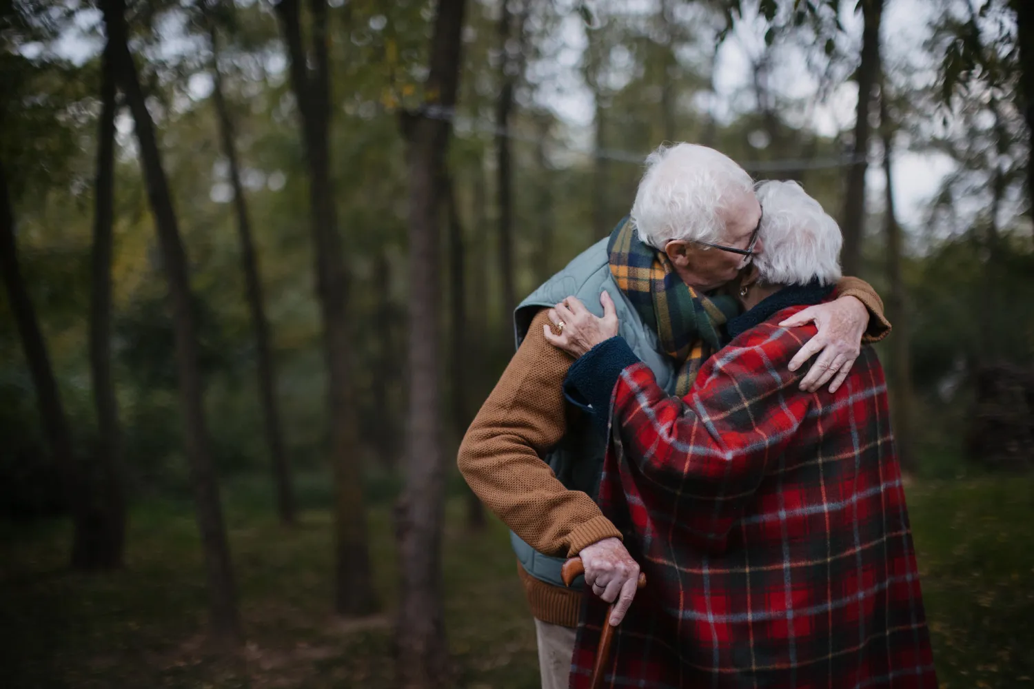 Why become a member of Ottawa Division_ Senior couple hugging each other in autumn forest.
